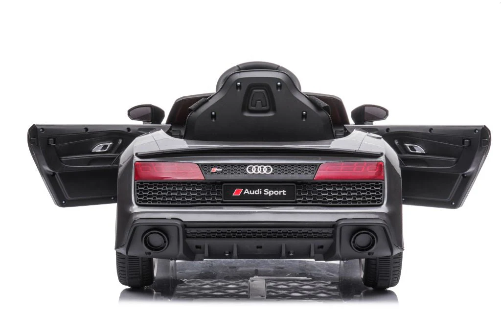 Rear view of luxe grey/silver Audi R8 licensed ride-on car for kids with open doors on a white background.