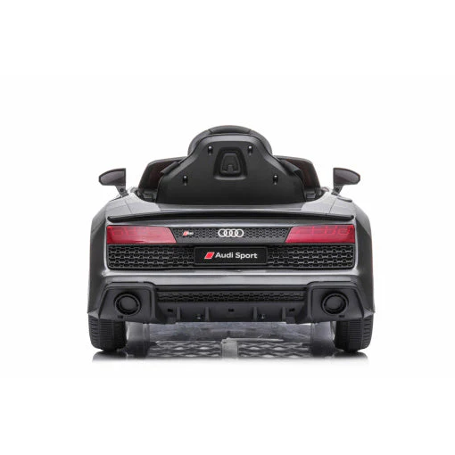 Rear view of luxe grey/silver Audi R8 licensed electric ride on car for kids against a white background.