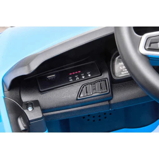 Interior dashboard of a blue Audi R8 electric ride-on car for kids, featuring air vents and control panel with MP3 Music Player.