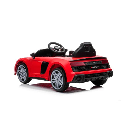 Red Audi R8 children's electric ride-on car, isolated on a white background