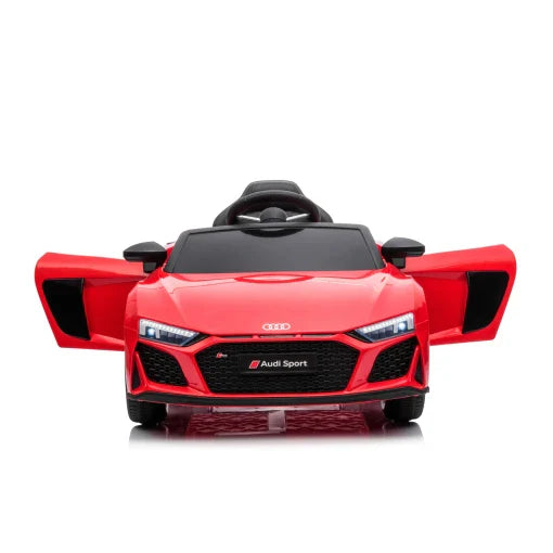 Red Audi R8 electric ride on car for kids, modeled after sport vehicle, isolated on white background.