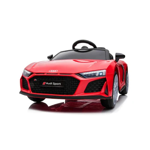 Red Audi R8 electric ride-on car toy for kids isolated on white background.