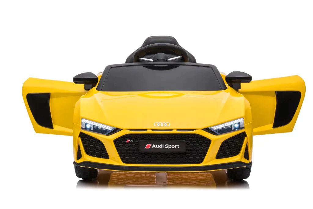 Yellow Audi R8 children's electric ride-on car, white background.