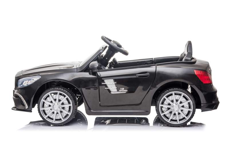 Black Mercedes SL63 kids electric ride on car isolated on a white background.