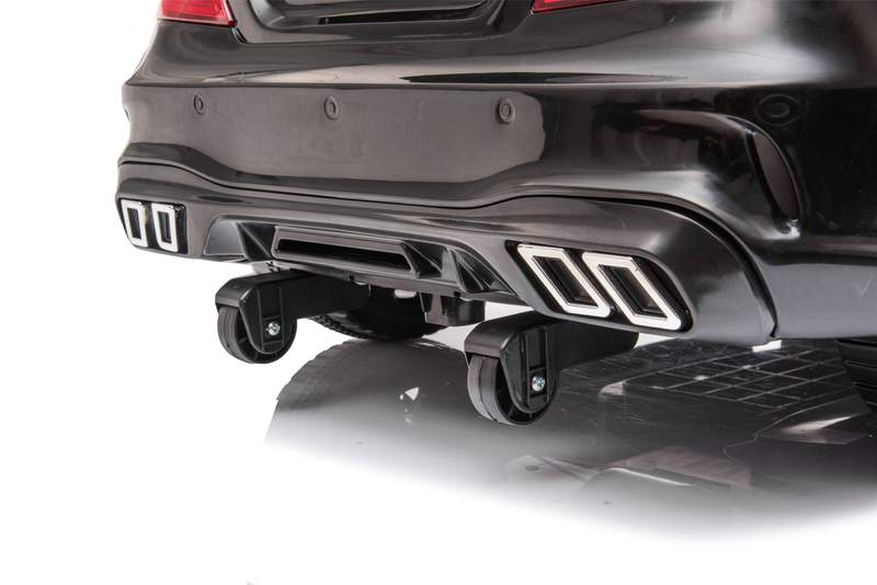 Rear view of black Mercedes SL63 children's electric ride-on car featuring dual exhaust system with quad tips.
