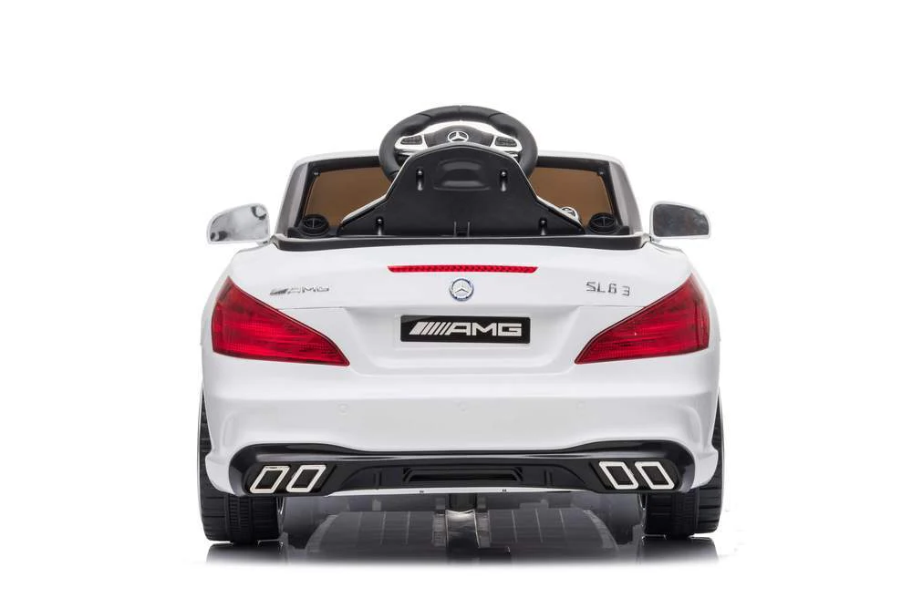 White Mercedes-Benz SL 63 electric ride-on car for children viewed from the rear, isolated on white background
