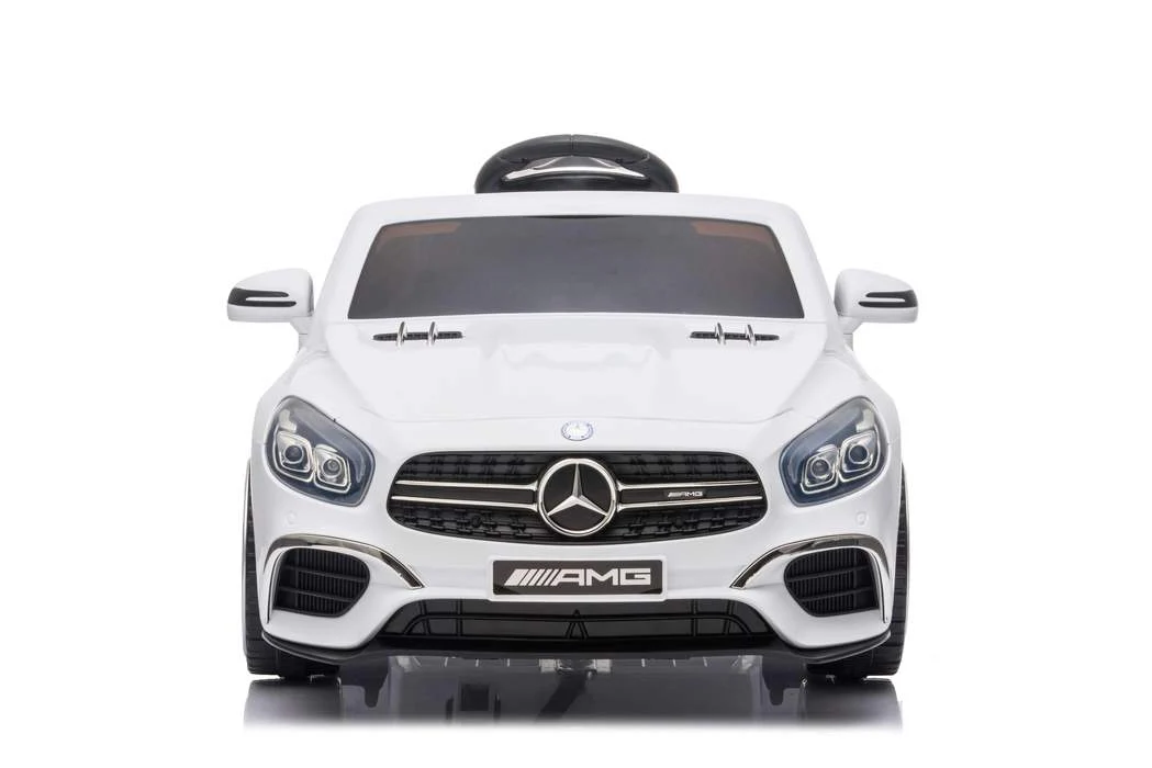 White Mercedes-Benz SL63 electric ride-on car for kids on a white background.
