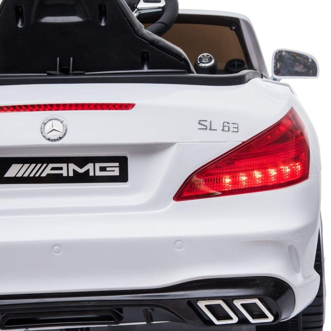 White Mercedes-Benz SL63 electric ride-on car for kids with visible brand logo and model designation.