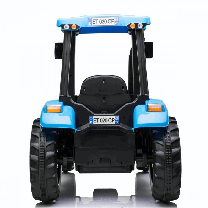 Blue and black licensed New Holland T7 kids electric tractor with remote control on a white background