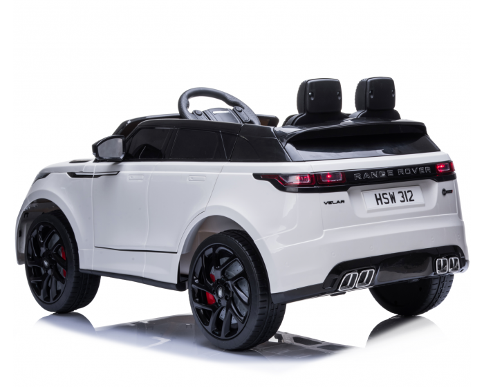 White luxury Range Rover Velar Autobiography SV electric ride-on toy car for children, isolated on white background.