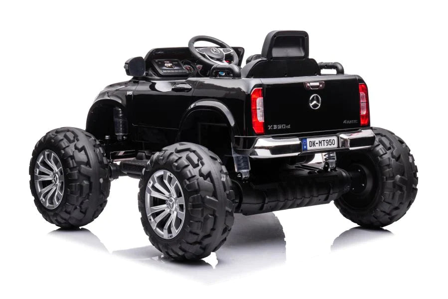 Black electric Mercedes Monster Truck toy car with oversized wheels for kids on a white background.